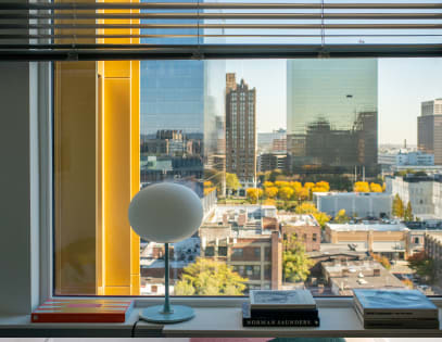 View of the designer living room details including oversized windows at Newark Urby - luxury Newark NJ apartments for rent